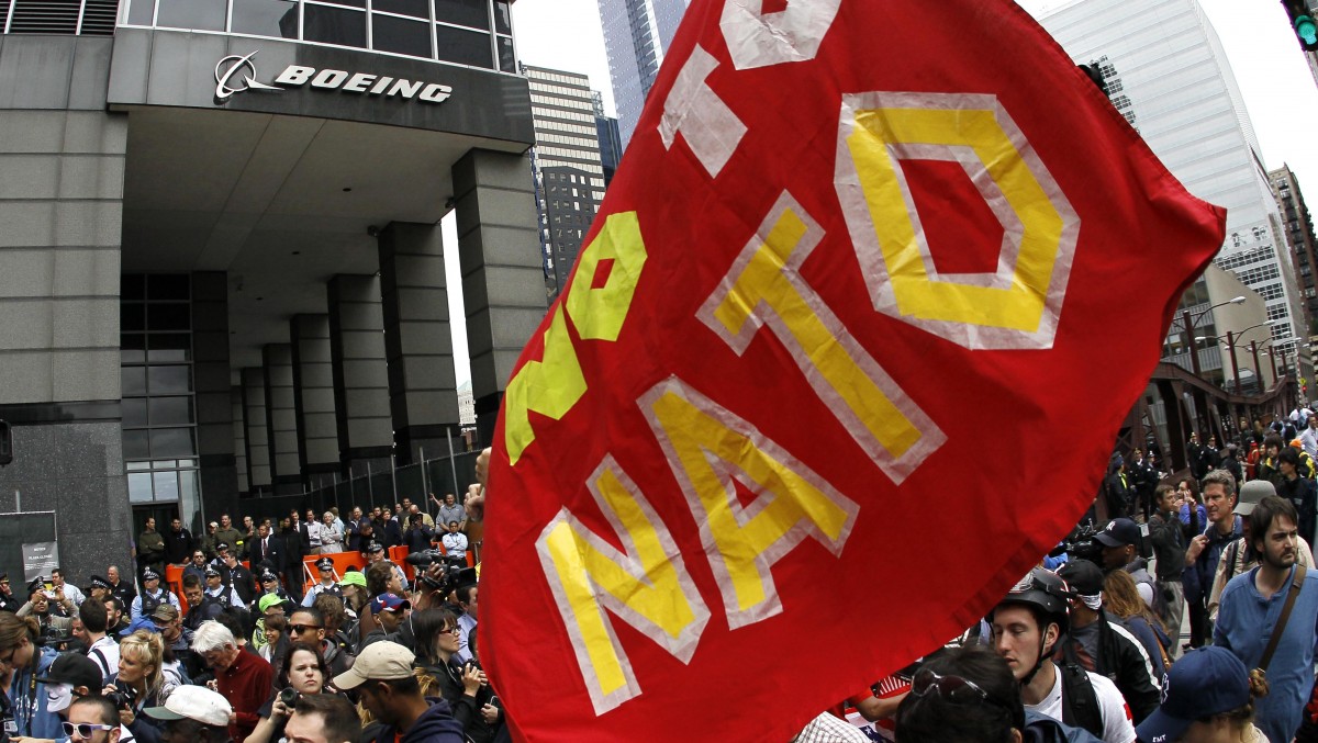 Protesters demonstrate outside Boeing's corporate offices Monday, May 21 2012, in Chicago, on the final day of the NATO summit. (AP Photo/Charles Rex Arbogast)