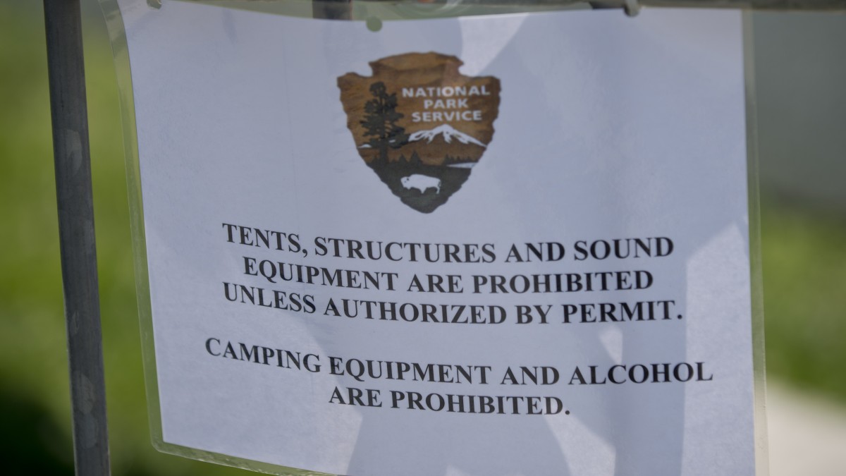 A sign lets activists at the Occupy National Gathering know what rules ...