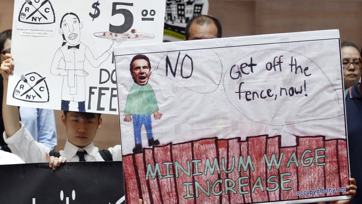 Supporters for a state minimum wage increase rally in Albany, N.Y., on Wednesday, June 13, 2012. (AP Photo/Mike Groll)