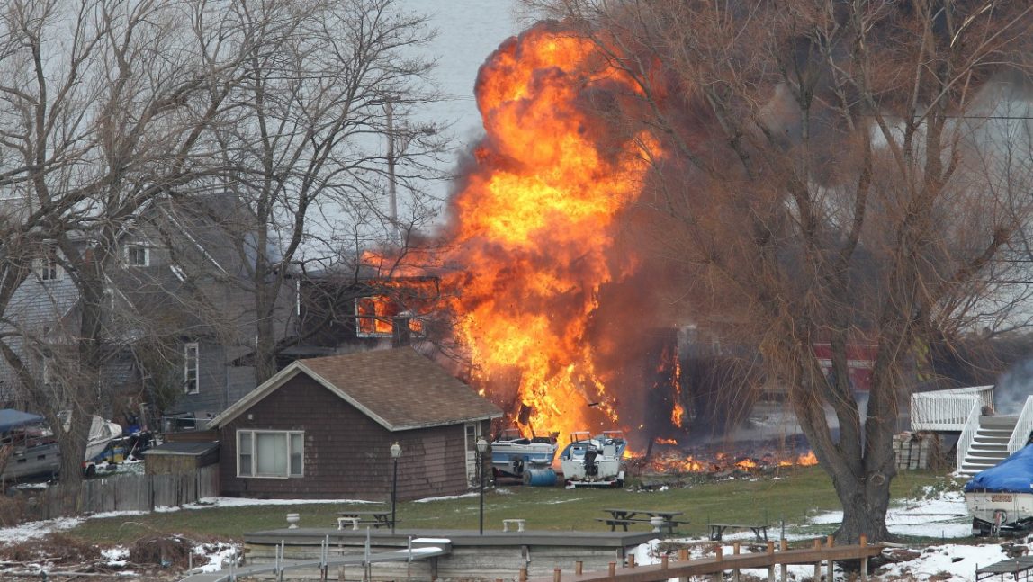 A house burns Monday, Dec. 24, 2012 in Webster, New York. (AP Photo/Democrat & Chronicle, Jamie Germano)
