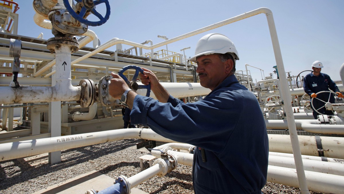 In this May 31, 2009 file photo, an employee works at the Tawke oil fields in the semiautonomous Kurdish region in northern Iraq. (AP Photo/Hadi Mizban, File)