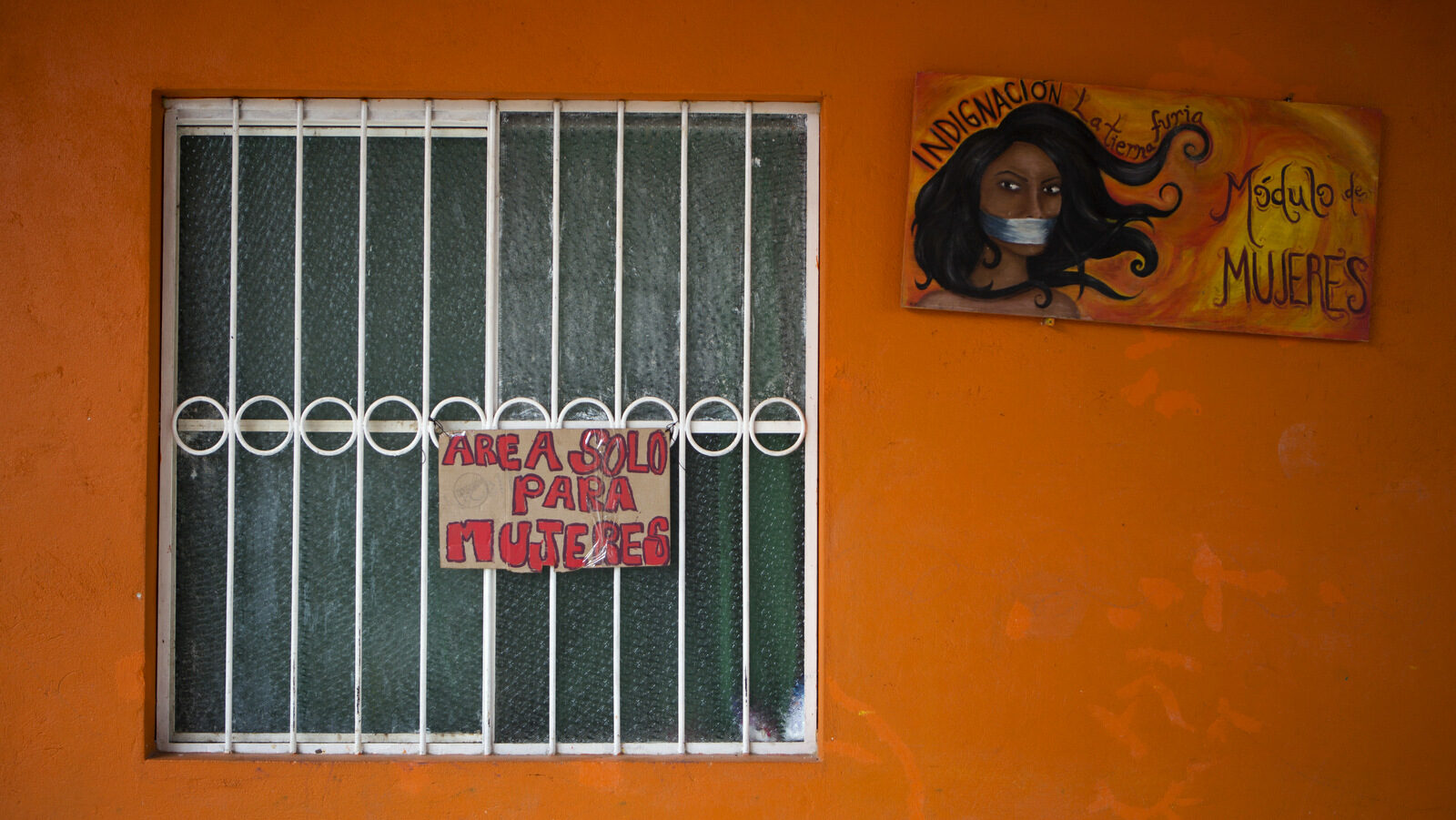 In this Dec. 6, 2016 photo, signs mark the women's dormitory at La 72, a migrant shelter in Tenosique, Tabasco state, Mexico. More than 8,000 immigrants have asked the Mexican government to grant them asylum this year. (AP/Rebecca Blackwell)