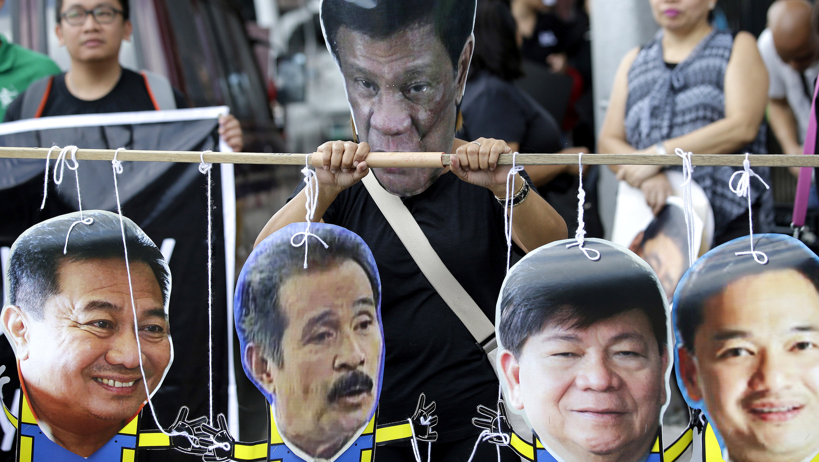 a-protester-wearing-a-mask-of-the-philippine-president-rodrigo-duterte