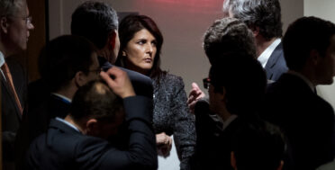 U.S. Ambassador to the United Nations Nikki Haley, center, confers with members of the United Nations Security Council just outside the chamber before a scheduled vote on a resolution, Feb. 24, 2018, demanding a 30-day humanitarian cease-fire across Syria. (AP/Craig Ruttle)