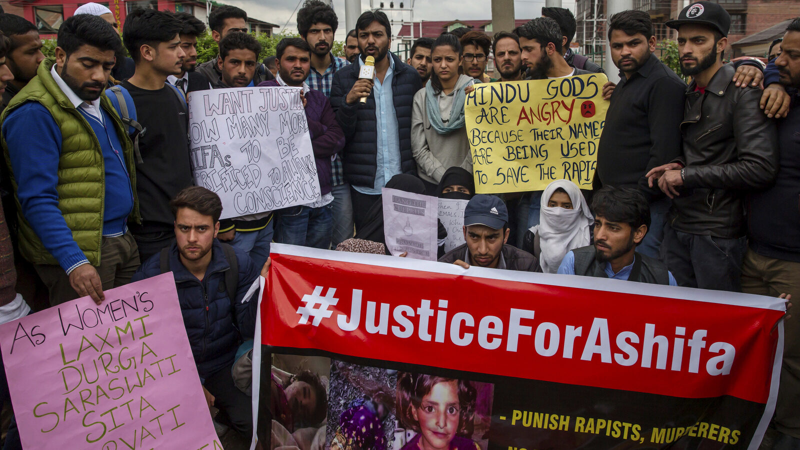 In this Wednesday, April 11, 2018 photo, students and others participate in a protest against the rape and murder of Asifa, an 8 year-old girl who was grazing her family's ponies on a chilly January day in the forests of the Himalayan foothills when she was kidnapped and her mutilated body found in the woods a week later, in Srinagar, Indian controlled Kashmir. Thousands of members of a radical Hindu group with links to the ruling party have marched to demand the release of six men accused in the repeated rape and murder of the Muslim girl inside a Hindu temple. Hundreds of Hindu lawyers have protested that the men, two of them police officers, are innocent. (AP Photo/Dar Yasin)