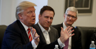 Peter Thiel founder of CIA-funded Palantir, listens as Donald Trump speaks during a meeting with tech leaders at Trump Tower in New York, Dec. 14, 2016. (AP/Evan Vucci)